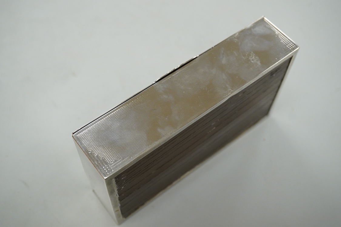 A George VI engine turned silver mounted rectangular cigarette box, by John Rose, Birmingham, 1936, 14.2cm.